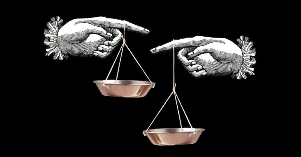 Black background with hand drawn hand pointing at each other holding brass weighing scales